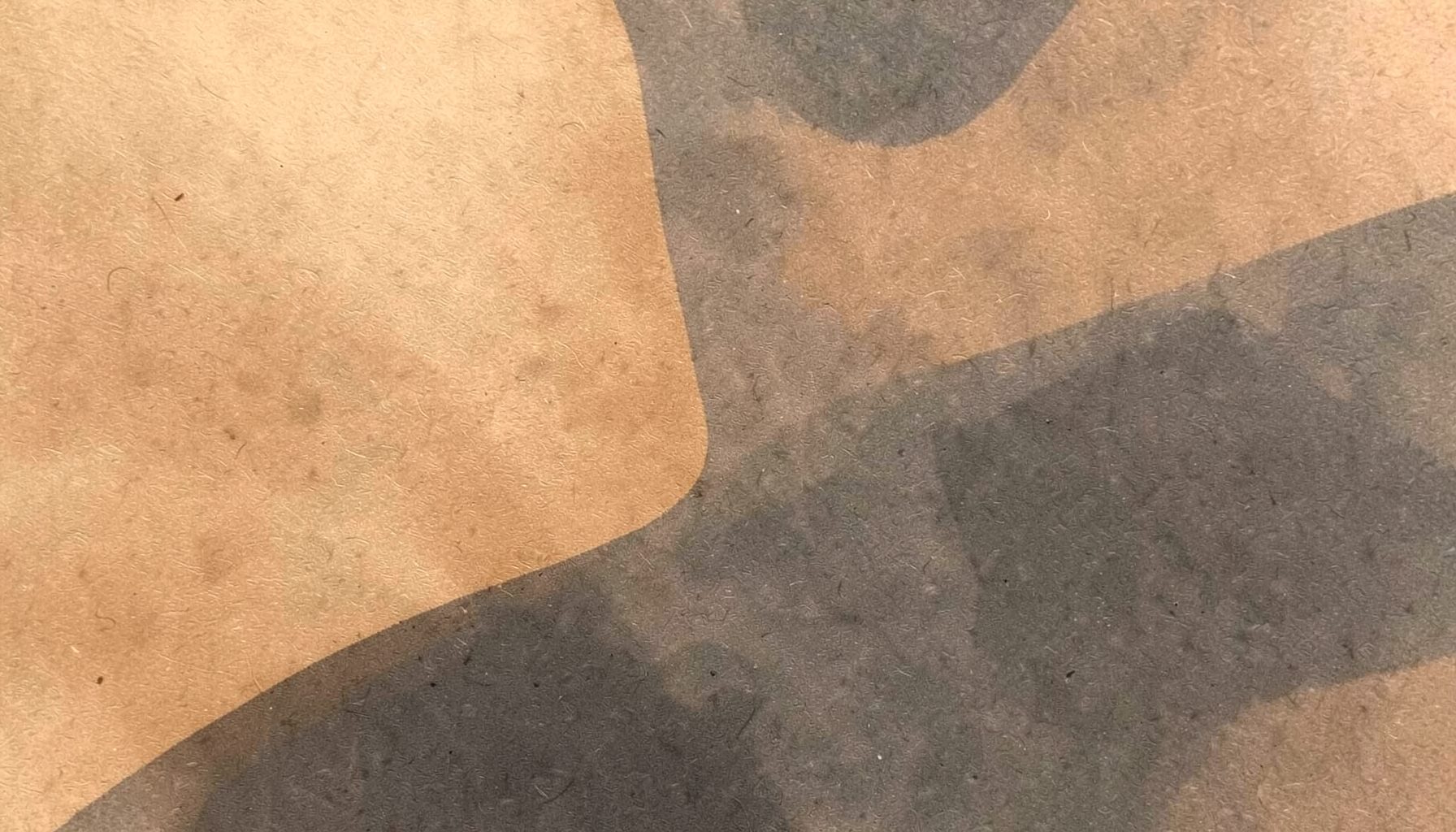 Warm tan paper texture with soft dark grey shadow shapes, calm minimal background